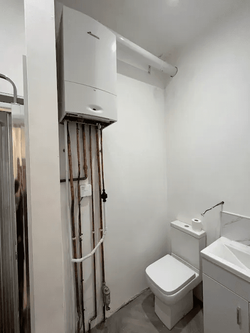 Domestic boiler installed in bathroom area in Devon