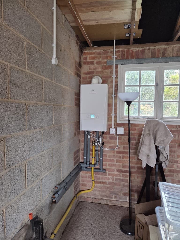 Ideal boiler installation in a garage utility space in Devon