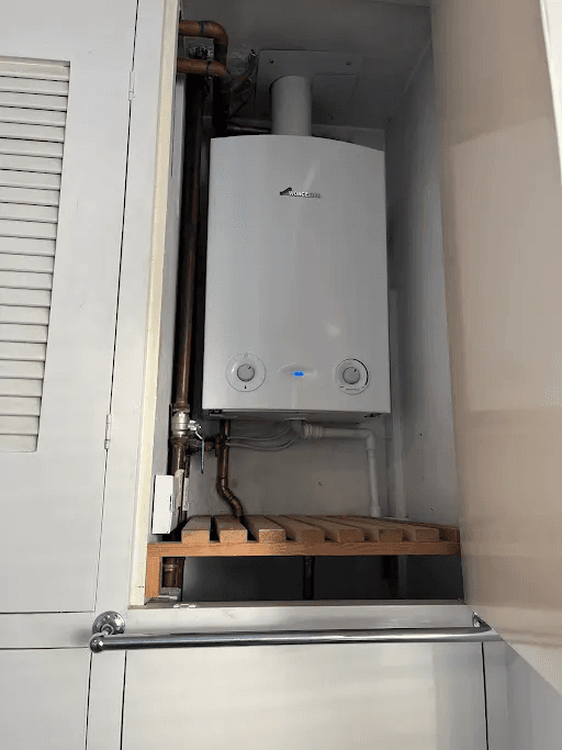 Worcester boiler installed neatly inside a domestic cupboard